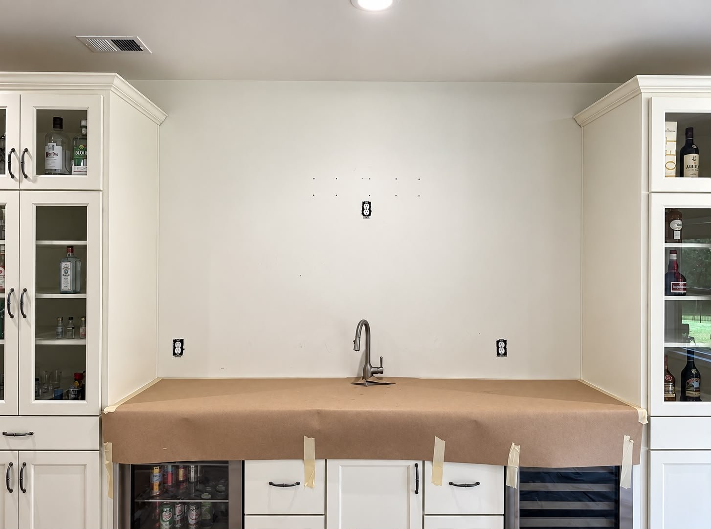 Basement wet bar wall before the stone feature finish