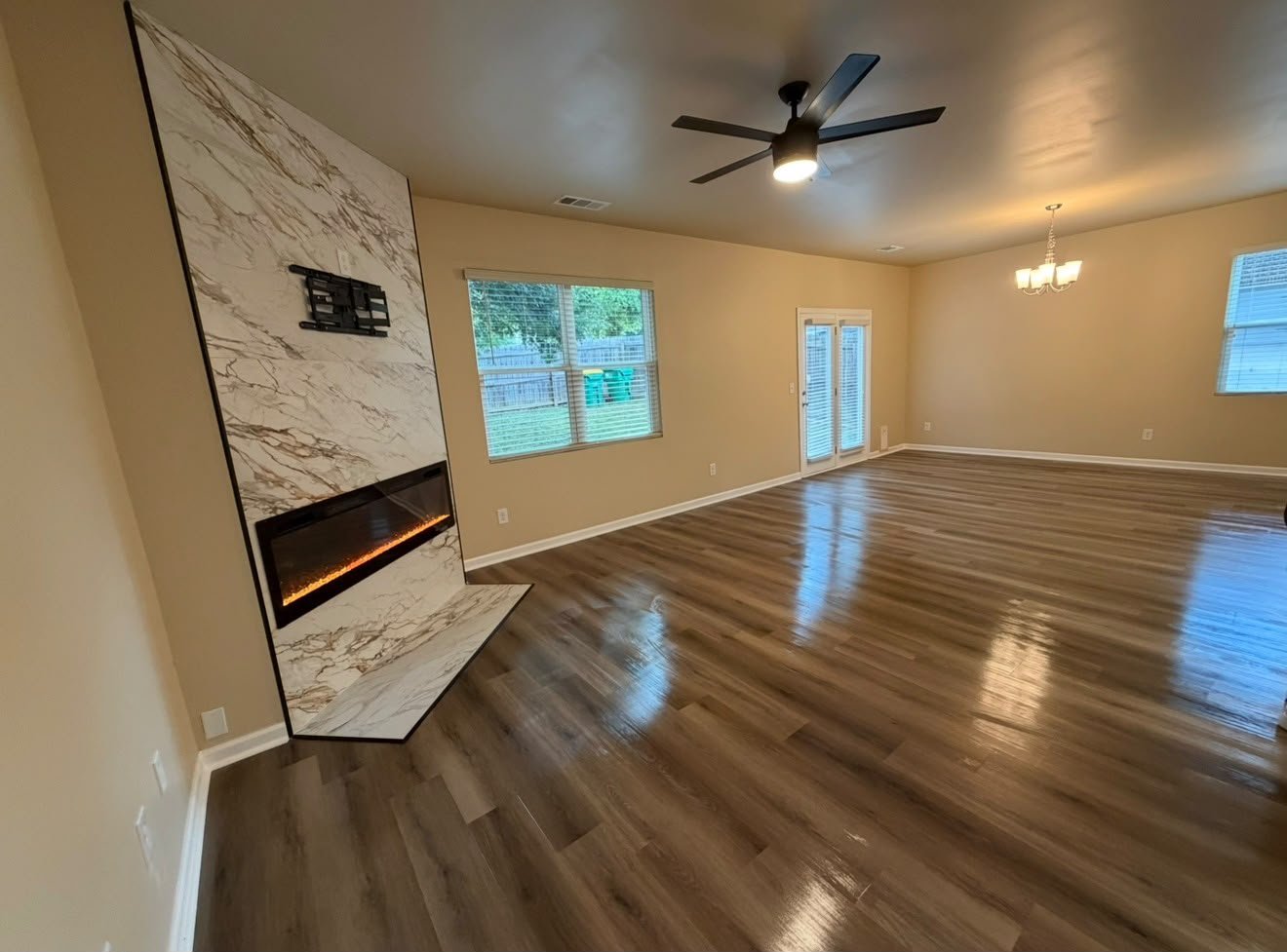 Completed living area with fresh paint and new LVP flooring